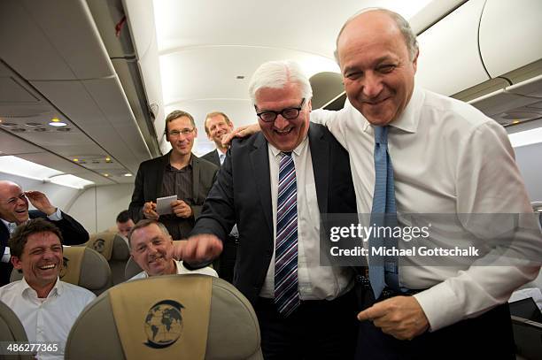 German Foreign Minister Frank-Walter Steinmeier and French Foreign Minister Laurent Fabius on board a German Air Force plane during the flight from...