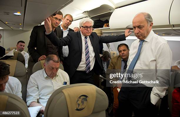 German Foreign Minister Frank-Walter Steinmeier and French Foreign Minister Laurent Fabius on board a German Air Force plane during the flight from...