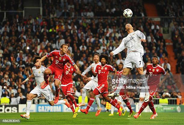 Cristiano Ronaldo of Real Madrid jumps for a header during the UEFA Champions League semi-final first leg match between Real Madrid and FC Bayern...