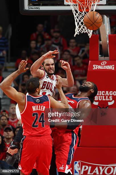 Joakim Noah of the Chicago Bulls passes the ball against the Washington Wizards during Game 1 of the Eastern Conference Quarterfinals on April 20,...