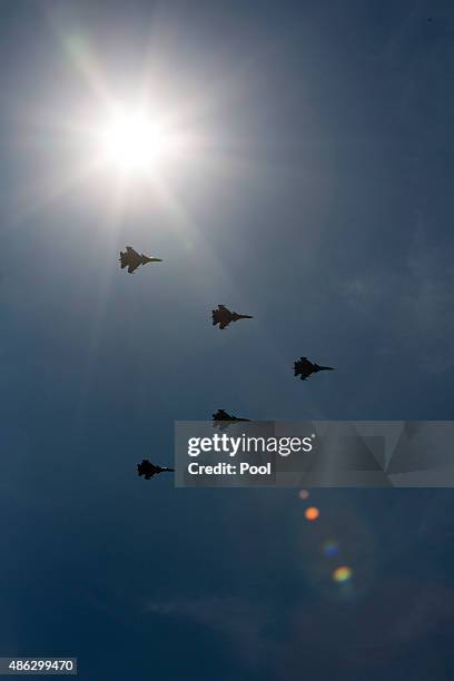 Chinese made carrier-borne J-15 fighter jets flying past Tiananmen Square during a military parade to mark the 70th anniversary of the end of World...