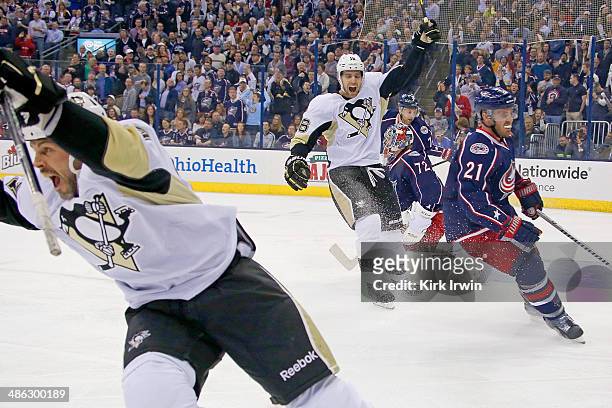 Craig Adams of the Pittsburgh Penguins and Brandon Sutter of the Pittsburgh Penguins celebrate after Adams scored a goal against the Columbus Blue...