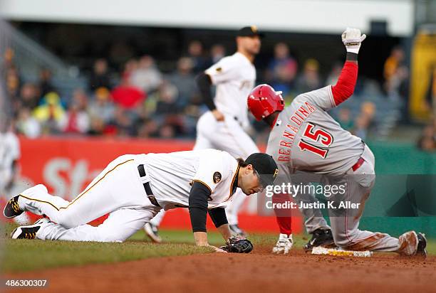 Roger Bernadina of the Cincinnati Reds slides in safe at second in the second inning against Neil Walker of the Pittsburgh Pirates during the game at...