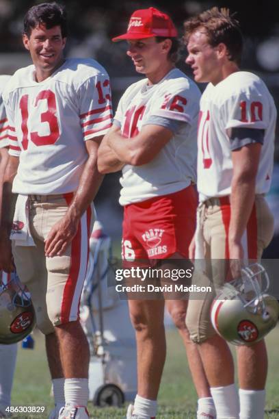 Joe Montana of the San Francisco 49ers watches his teammates during preseason training camp held during August, 1989 at Sierra College in Rocklin,...