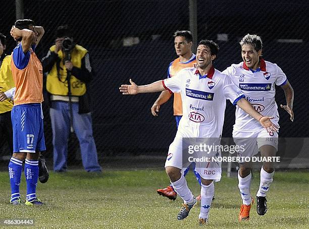 Paraguay's Nacional player Julian Benitez celebrates with teammate Silvio Torales after scoring against Argentina's Velez Sarsfield during their Copa...