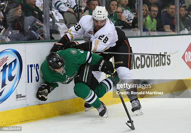 Tyler Seguin of the Dallas Stars skates the puck against Mark Fistric of the Anaheim Ducks in the first period during Game Four of the First Round of...