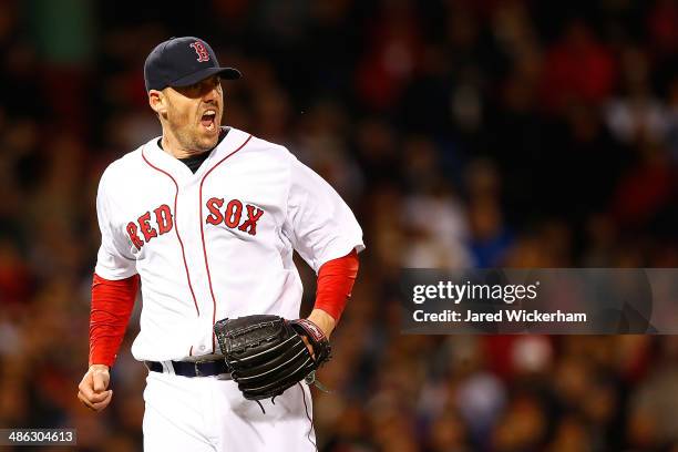 John Lackey of the Boston Red Sox reacts after getting out of the fifth inning with men on base against the New York Yankees during the game at...