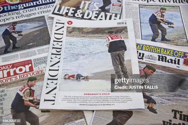 The front pages of some of Britain's daily newspapers showing an image of the body of Syrian three-year-old boy Aylan are pictured in London, on...