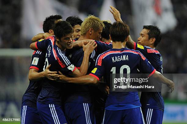 Keisuke Honda of Japan celebrates the first goal with teammates during the 2018 FIFA World Cup Qualifier Round 2 - Group E match between Japan and...