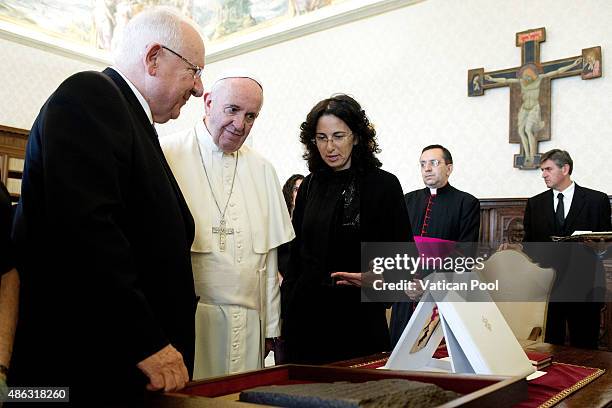 Pope Francis exchanges gifts with Israeli President Reuven Rivlin at his private library in the Apostolic Palace on September 3, 2015 in Vatican...