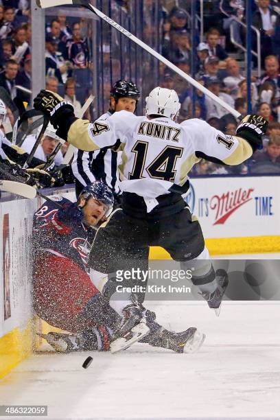 Boone Jenner of the Columbus Blue Jackets collides with Chris Kunitz of the Pittsburgh Penguins during the second period in Game Four of the First...