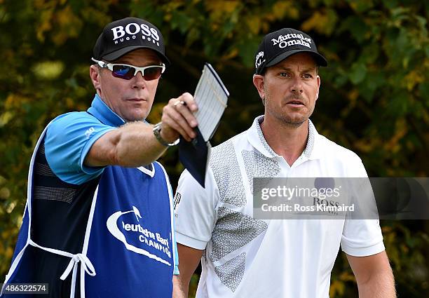 Henrik Stenson of Sweden and his caddie Gareth Lord in action during the pro-am event prior to the Deutsche Bank Championship at TPC Boston on...