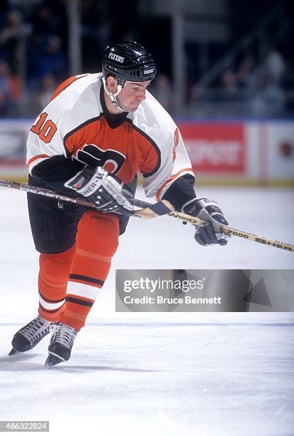 John LeClair of the Philadelphia Flyers skates on the ice during an NHL game against the New York Islanders on January 28, 1998 at the Nassau...