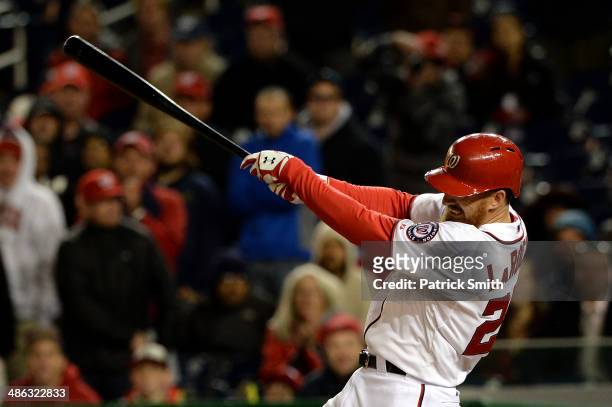 Adam LaRoche of the Washington Nationals hits an RBI single to win the game in the ninth inning against the Los Angeles Angels of Anaheim at...
