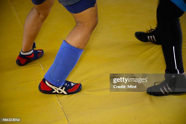 Traniee wrestlers during the training session at Balali akhara features both boys and girls in Balali Village on August 21, 2014 in Bhiwani, India....