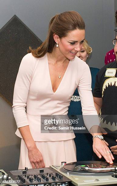 Catherine, Duchess of Cambridge plays on DJ decks at the youth community centre, The Northern Sound System in Elizabeth on April 23, 2014 in...