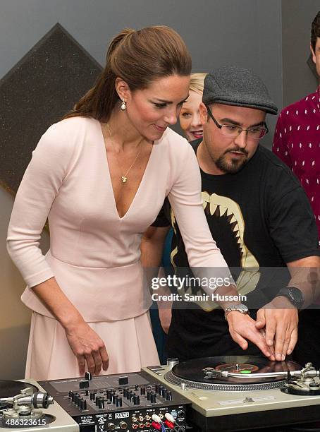 Catherine, Duchess of Cambridge plays on DJ decks at the youth community centre, The Northern Sound System in Elizabeth on April 23, 2014 in...