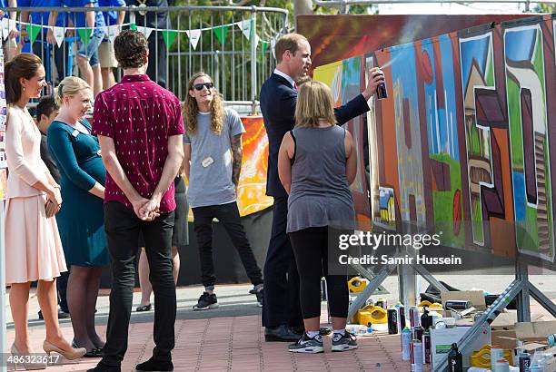 Prince William, Duke of Cambridge spray paints a wall at the community centre, The Northern Sound System in Elizabeth on April 23, 2014 in Adelaide,...