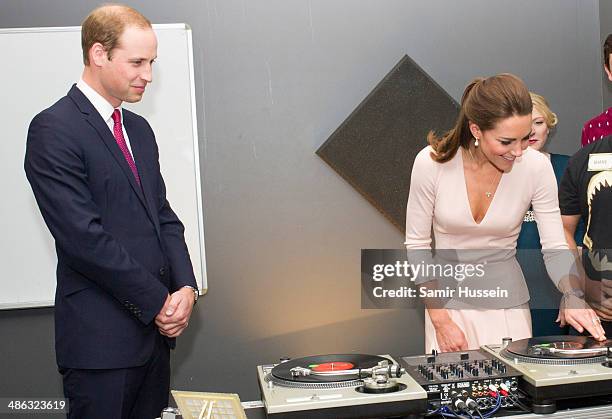 Catherine, Duchess of Cambridge and Prince William, Duke of Cambridge play on DJ decks at the youth community centre, The Northern Sound System in...