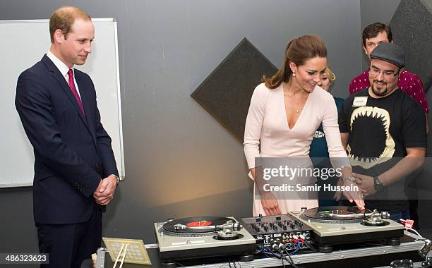 Catherine, Duchess of Cambridge and Prince William, Duke of Cambridge play on DJ decks at the youth community centre, The Northern Sound System in...