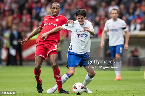 Wilson Tiago Mathias of Toluca fights for the ball with Mauro Formica of Cruz Azul during the leg 2 of the final match between Cruz Azul and Toluca...