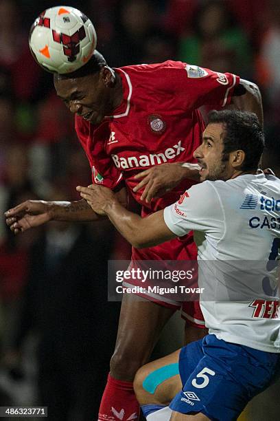 Wilson Tiago Mathias of Toluca fights for the ball with Alejandro Castro of Cruz Azul during the leg 2 of the final match between Cruz Azul and...