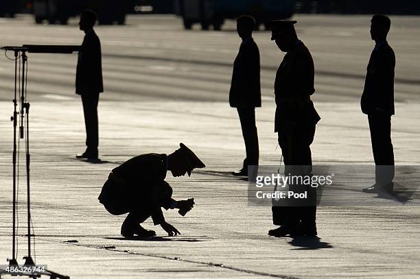 Chinese soldier marks the floor ahead of a military parade at Tiananmen Square to mark the 70th anniversary of the end of World War Two on September...