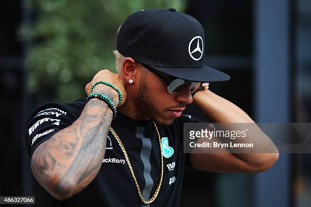 Lewis Hamilton of Great Britain and Mercedes GP looks on in the paddock during previews to the Formula One Grand Prix of Italy at Autodromo di Monza...