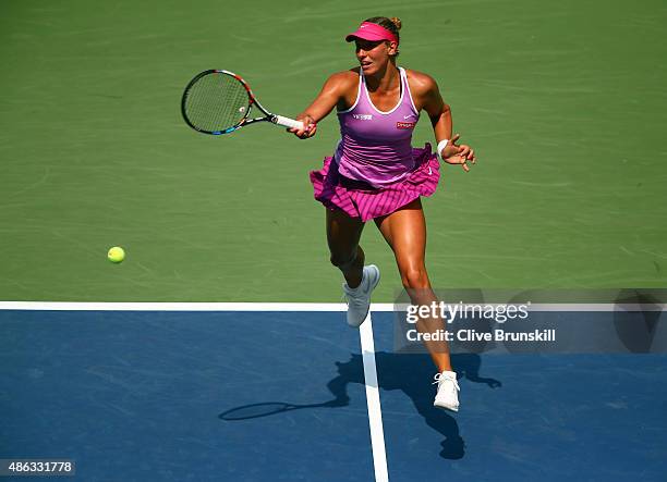 Yanina Wickmayer of Belgium returns a shot to Victoria Azarenka of Belarus during their Women's Singles Second Round match on Day Four of the 2015 US...