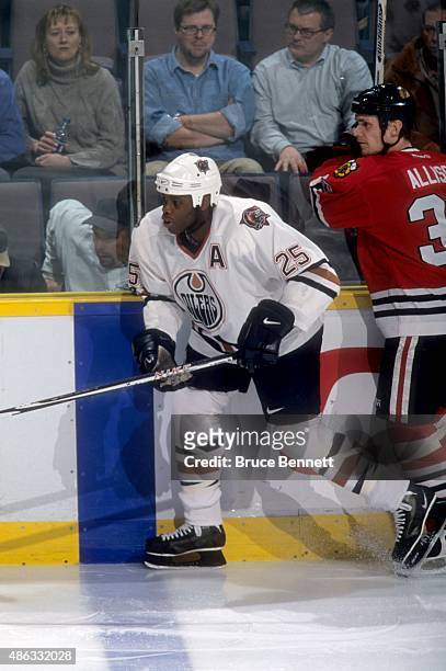 Mike Grier of the Edmonton Oilers skates on the ice during an NHL game against the Chicago Blackhawks on January 31, 2001 at the Rexall Place in...