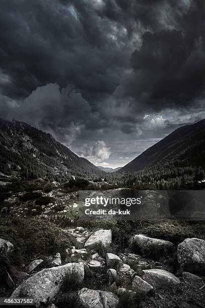 mountains at storm - the valley stockfoto's en -beelden