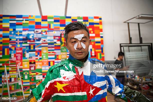 Liu Bolin creates art for the Global Goals campaign at Liu Bolin Studio August 28, 2015 in Beijing, China.