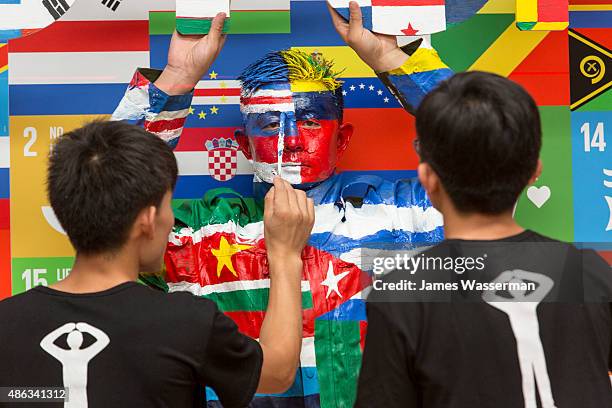 Liu Bolin creates art for the Global Goals campaign at Liu Bolin Studio August 28, 2015 in Beijing, China.