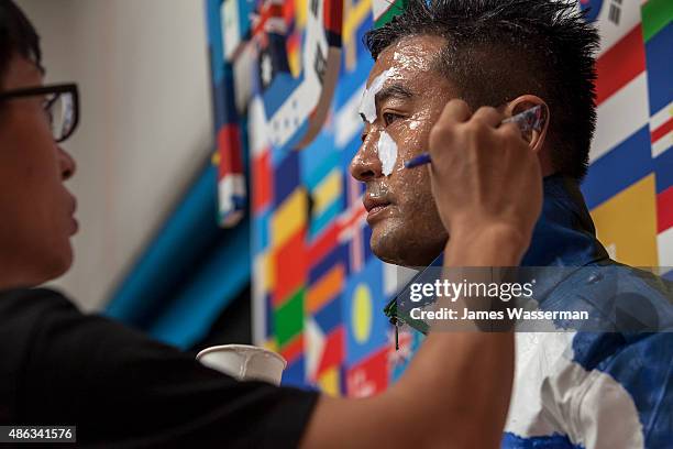 Liu Bolin creates art for the Global Goals campaign at Liu Bolin Studio August 28, 2015 in Beijing, China.