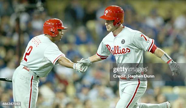 Jayson Nix of the Philadelphia Phillies is greeted by on deck batter Ben Revere after hitting a solo home run in the eighth inning against the Los...