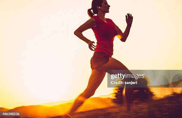 adult woman running outdoors - ultra marathon stock pictures, royalty-free photos & images