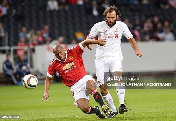 Quinton Fortunem of Manchester United vies with Patrik Berger of Liverpool during the charity football match Manchester United Legends vs Liverpool...