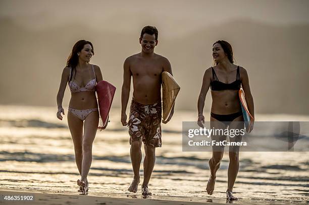 friends going surfing - north shore oahu stock pictures, royalty-free photos & images