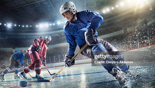 ice hockey player on hockey arena - ice hockey skate stock pictures, royalty-free photos & images