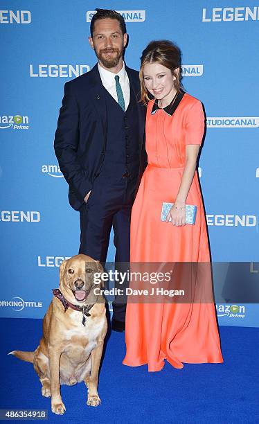 Tom Hardy with his dog Woody and Emily Browning attend the UK Premiere of "Legend" at Odeon Leicester Square on September 3, 2015 in London, England.