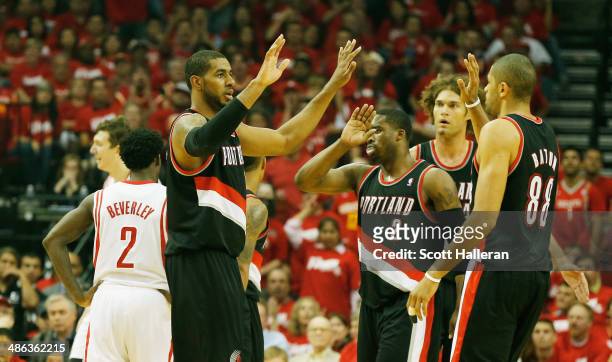 LaMarcus Aldridge, Wesley Matthews, Robin Lopez and Nicolas Batum of the Portland Trail Blazers celebrate a play on the court in the first half of...