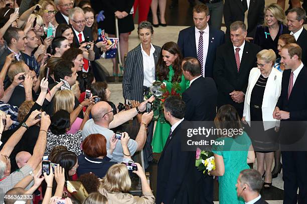 Catherine, Duchess of Cambridge is accompanied by Prime Minister Tony Abbott, greets members of the public on their departure from a reception hosted...