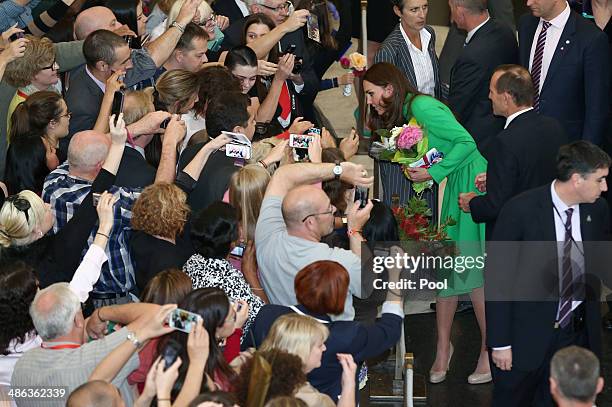 Catherine, Duchess of Cambridge is accompanied by Prime Minister Tony Abbott, greets members of the public on their departure from a reception hosted...
