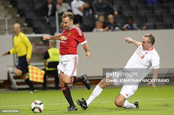 Didi Hamann of Liverpool vies with Karel Poborsky of Manchester United during the charity football match Manchester United Legends vs Liverpool...