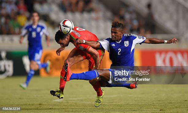 Wales player Hal Robson-Kanu is challenged by Dossa Junior of Cyprus during the UEFA EURO 2016 Qualifier between Cyprus and Wales at GPS Stadium on...