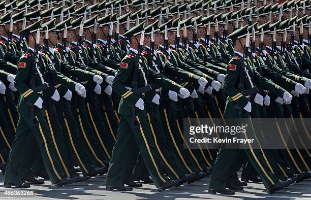 Chinese soldiers march in formation past Tiananmen Square and the Forbidden City during a military parade on September 3, 2015 in Beijing, China....
