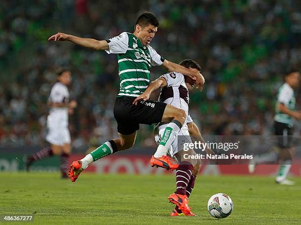 Oribe Peralta of Santos competes for the ball during a second round match between Santos and Lanus as part of the Copa Bridgestone Libertadores 2014...