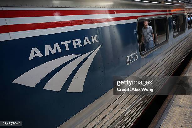 Passenger passes by an Amtrak train September 3, 2015 at Union Station in Washington, DC. U.S. Secretary of Homeland Security Jeh Johnson held a...