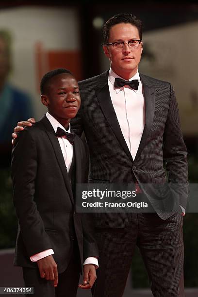 Actor Abraham Attah and director Cary Fukunaga attend the premiere of 'Beasts Of No Nation' during the 72nd Venice Film Festival on September 3, 2015...