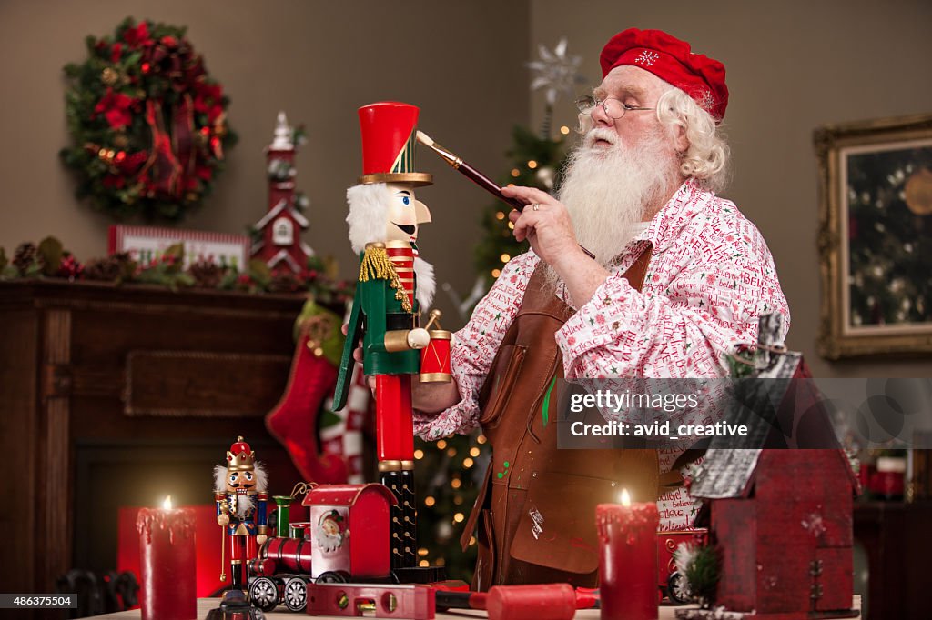 Santa Claus Painting Nutcracker in Toy Shop
